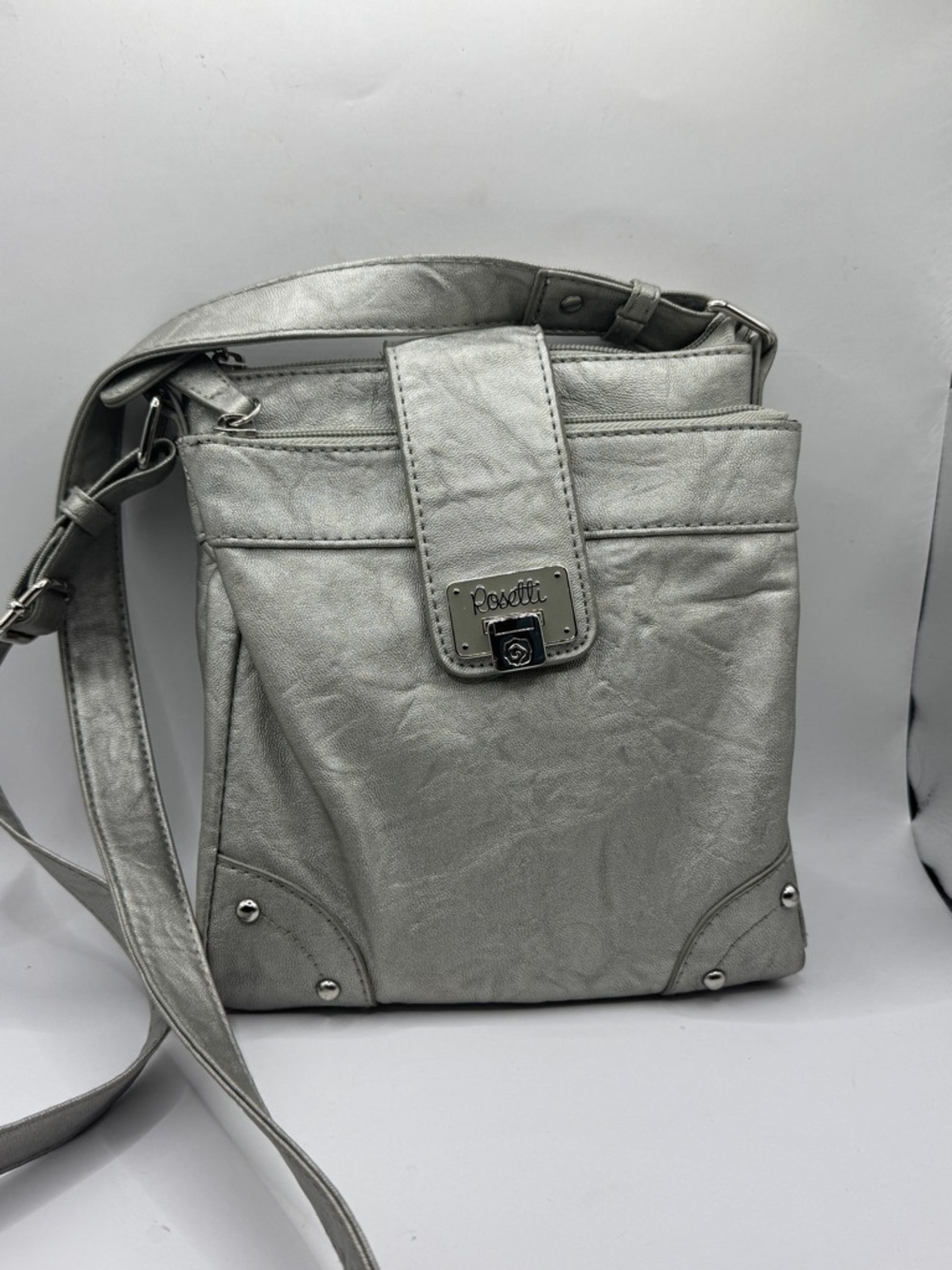 Rosetti silver crossbody organizer handbag.